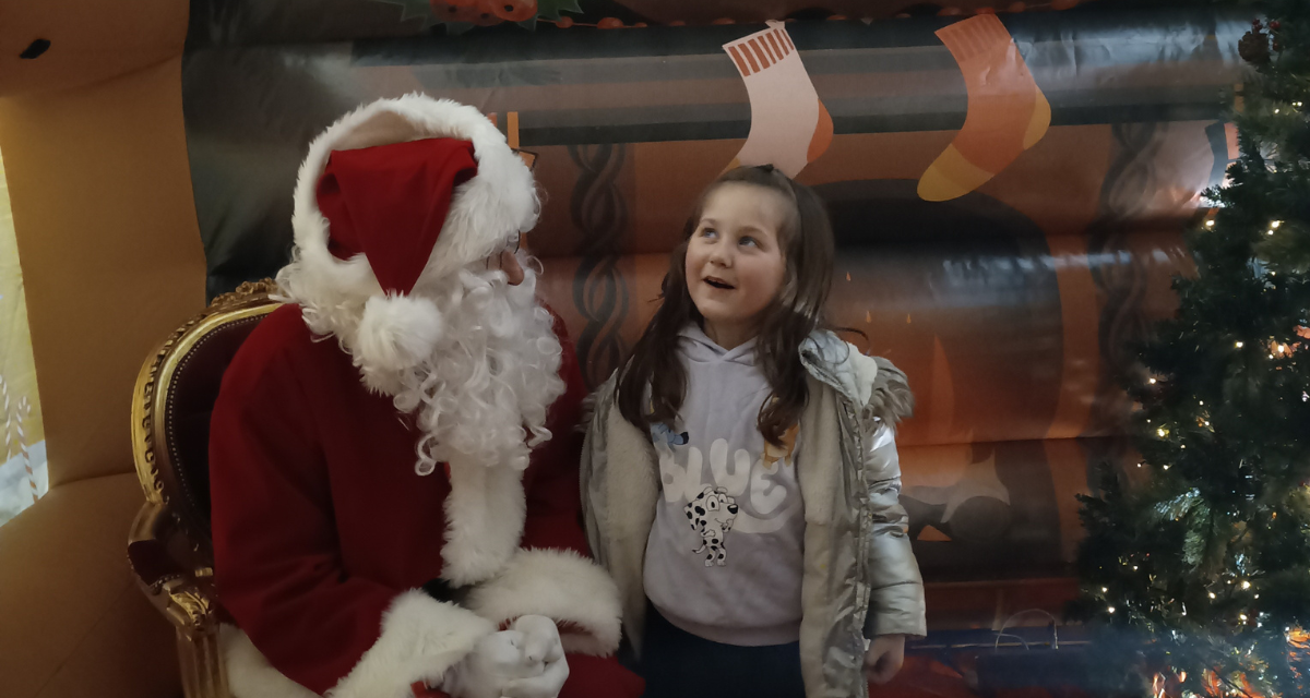 Santa speaking to child