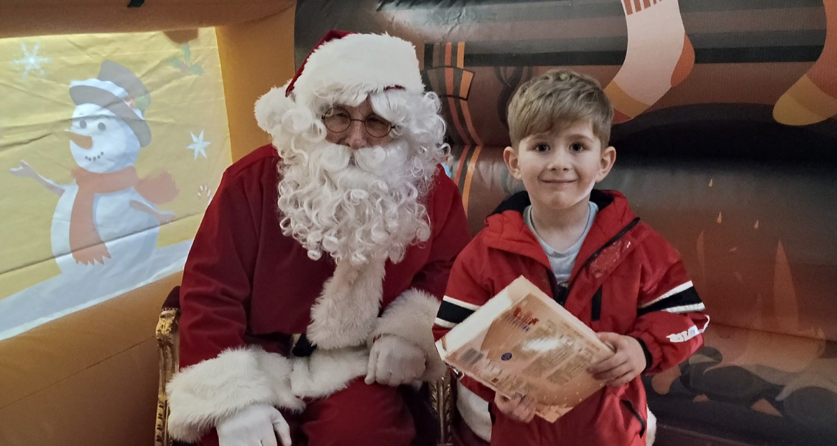 Santa and child with selection box